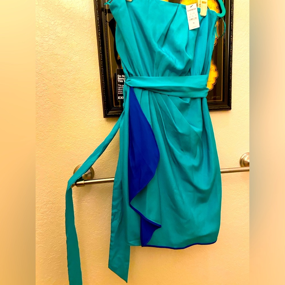 Strapless Express turquoise dress with side zipper. Wrap around tie. Size 10